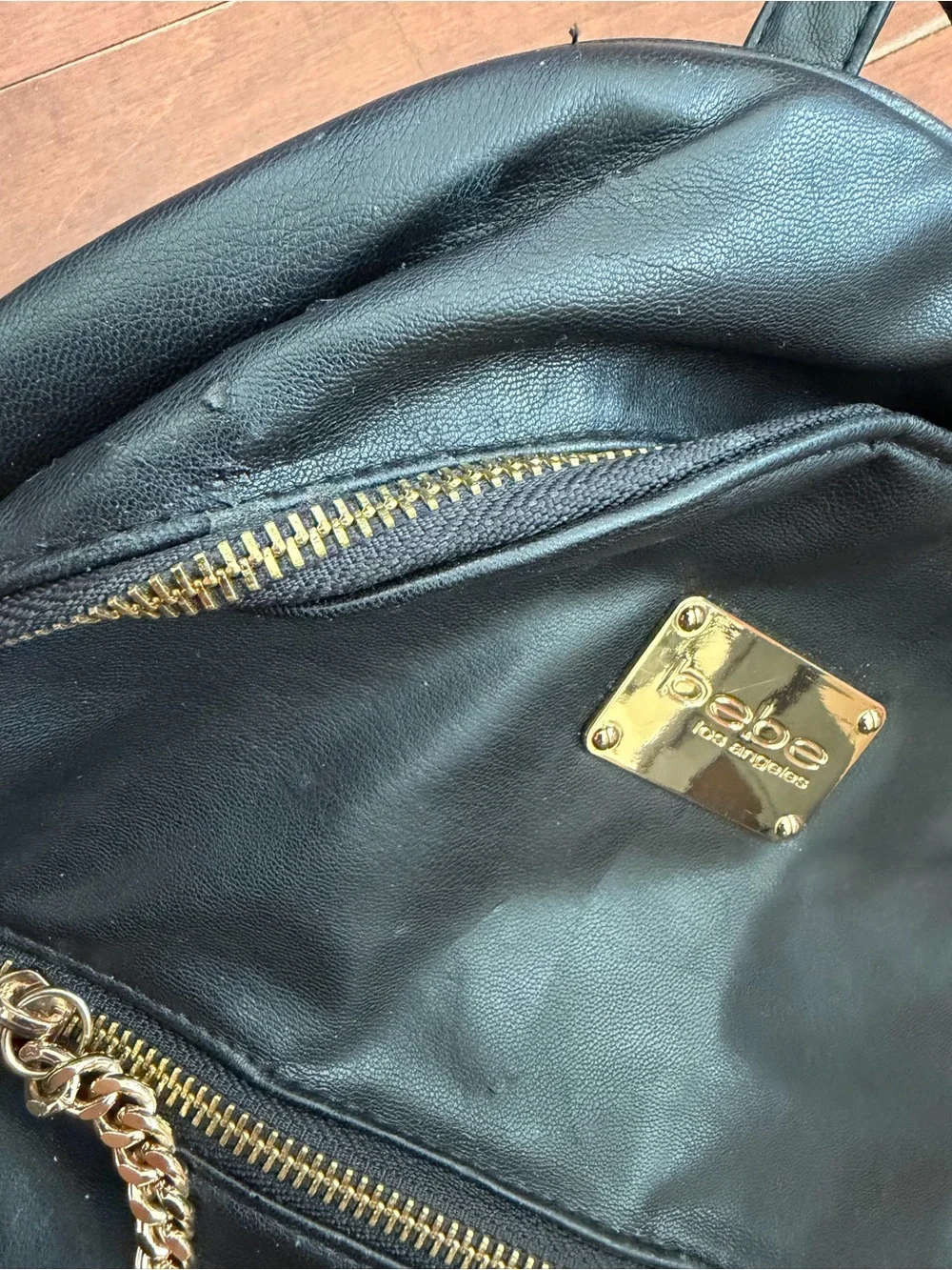 bebe Black Quilted Faux-Leather Backpack with Gold Chain & Plaque